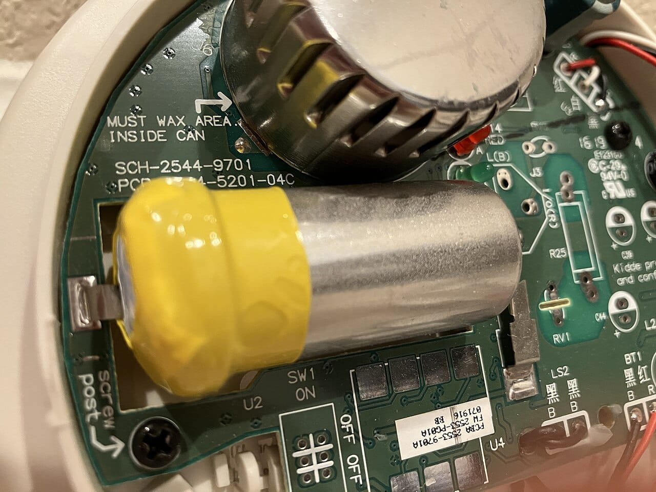 Battery-powered carbon monoxide alarm mounted in a home for winter freeze safety in Austin
