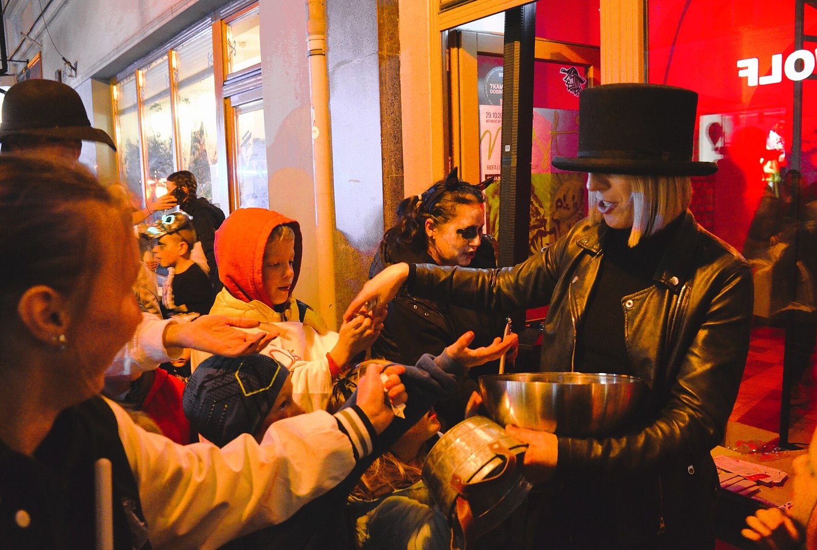 Children trick-or-treating on a town street, a key part of Halloween safety by age
