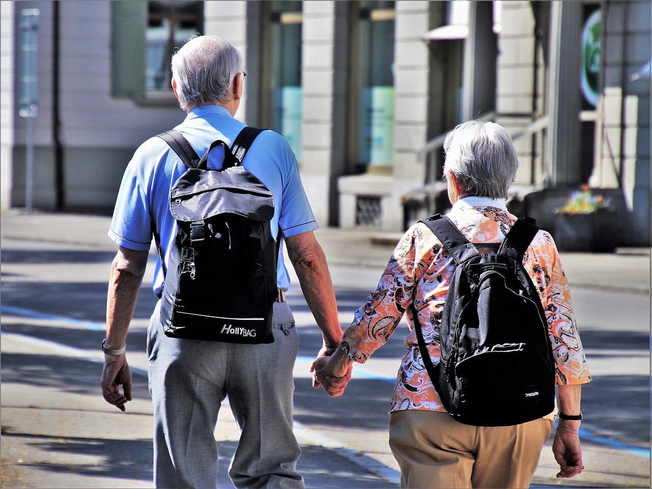 Older couple holding hands outdoors, a reminder of protecting seniors and infants during severe Austin weather swings